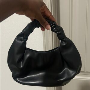 The drop classy Black top handle bag/purse